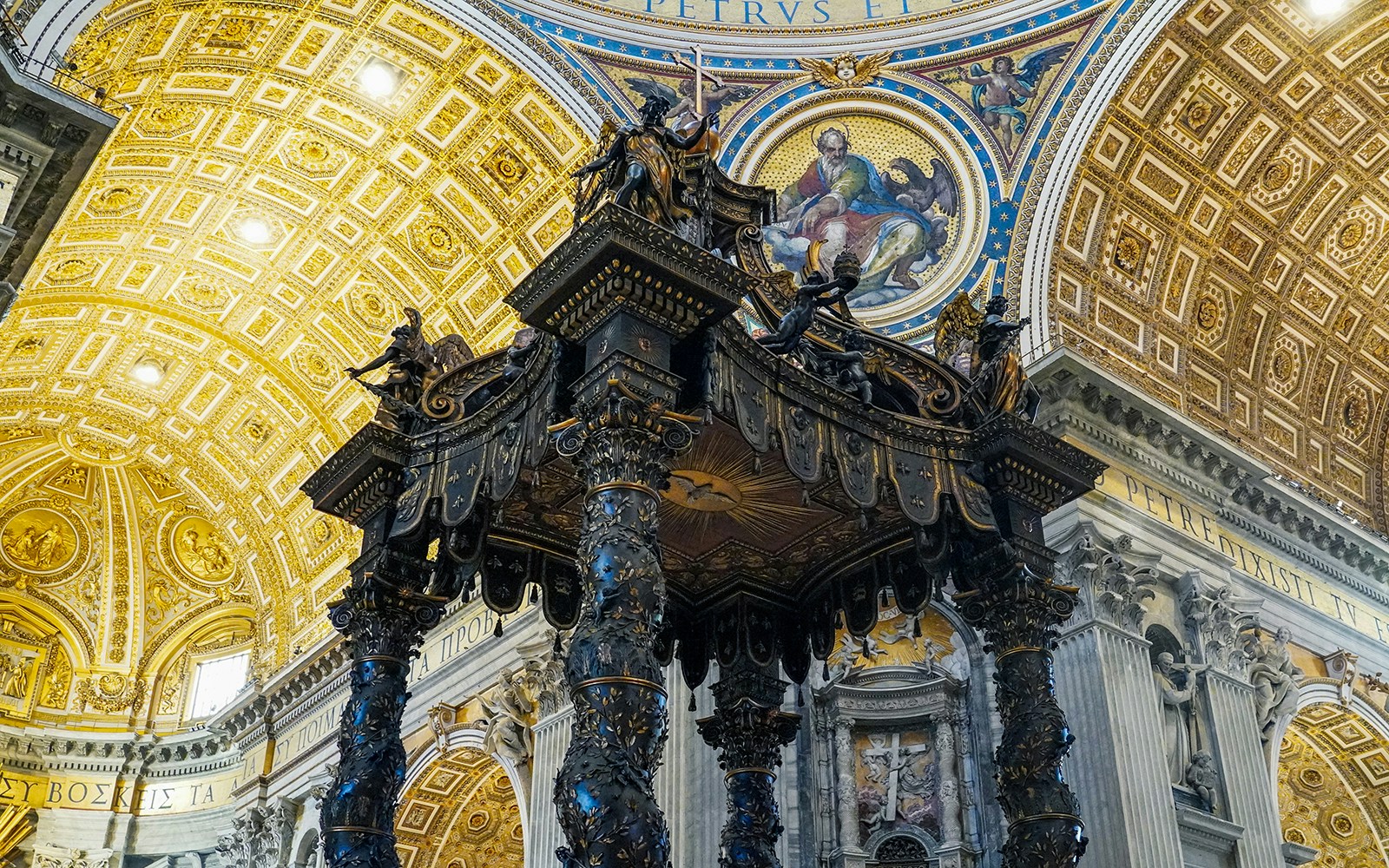 Great Canopy Baldacchino inside St. Peter's Basilica, Rome, with intricate bronze details.