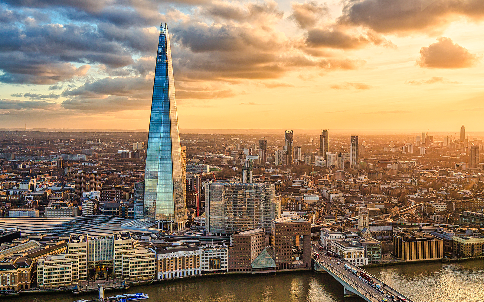Aerial view of The Shard in London at sunset with cityscape.