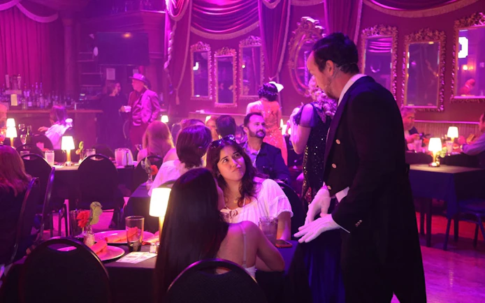 Guests enjoying a murder mystery dinner show at a Buena Park speakeasy.