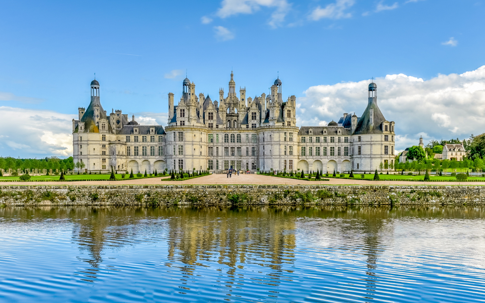 Chambord Castle in France with reflection in the water.