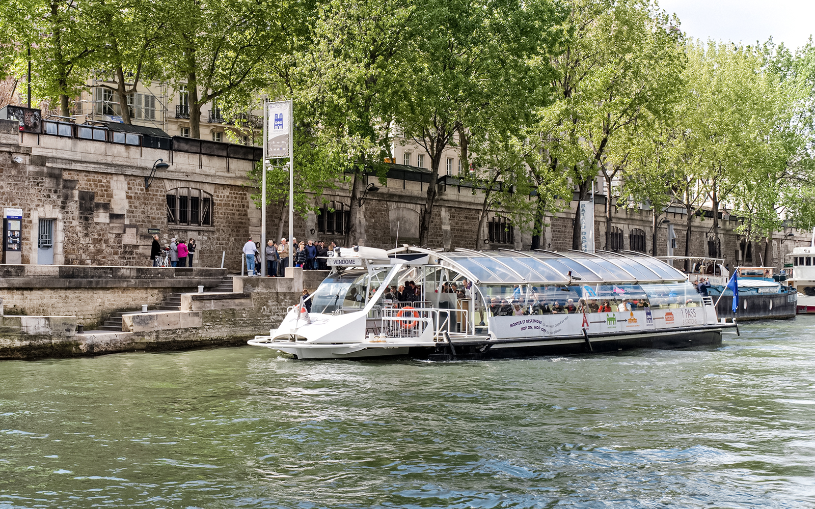 Batobus river cruise on the Seine with Eiffel Tower in the background, Paris.