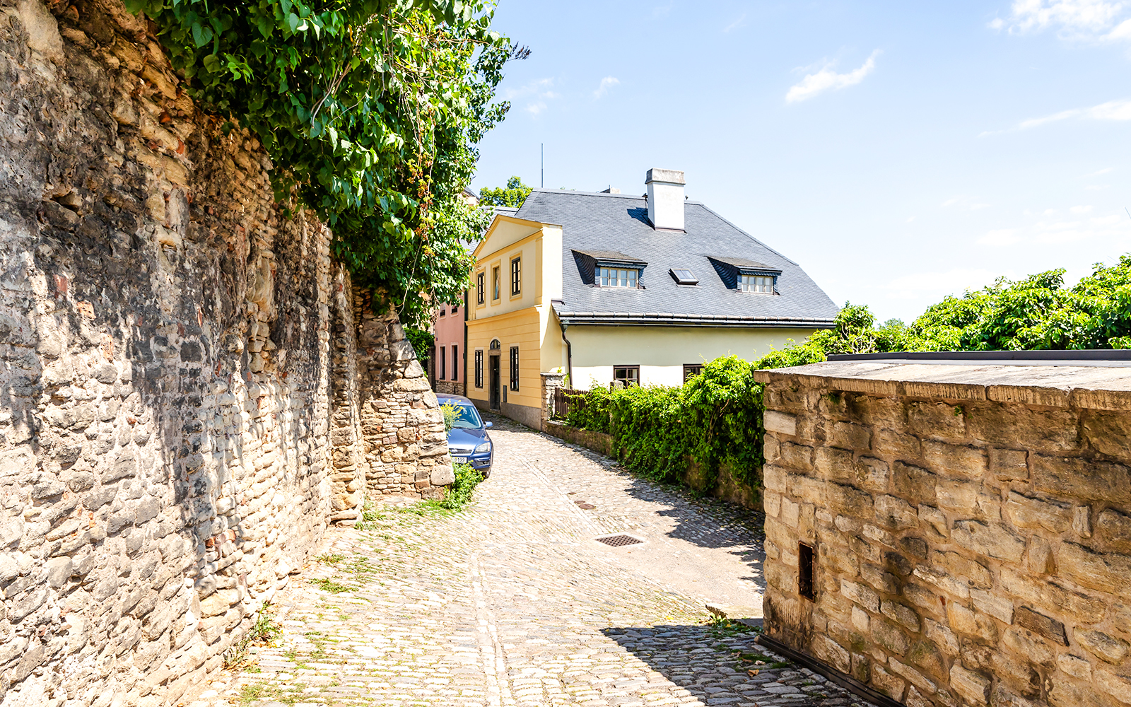 Historic buildings on cobblestone Ruthardska Street in Kutna Hora, Czech Republic.