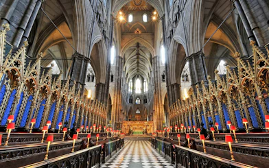 Westminster Abbey interior with ornate arches and choir stalls, London.
