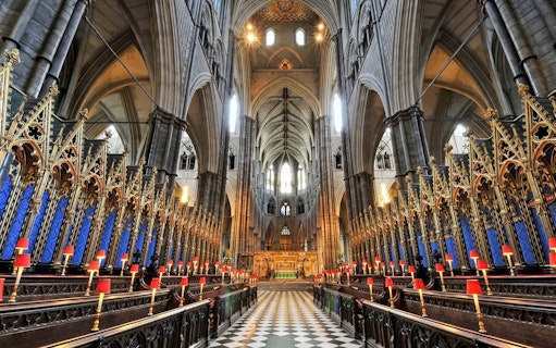 Westminster Abbey interior with ornate arches and choir stalls, London.