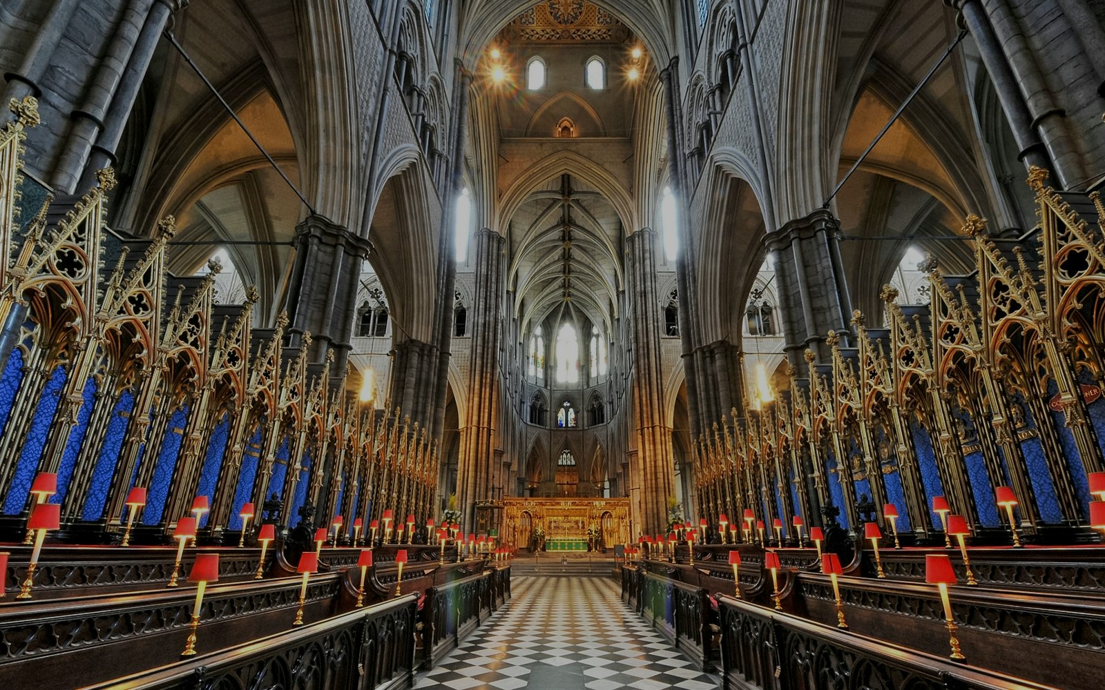 Westminster Abbey interior with ornate arches and choir stalls, London.