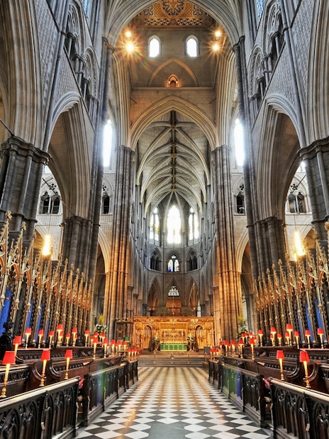 Westminster Abbey interior with ornate arches and choir stalls, London.