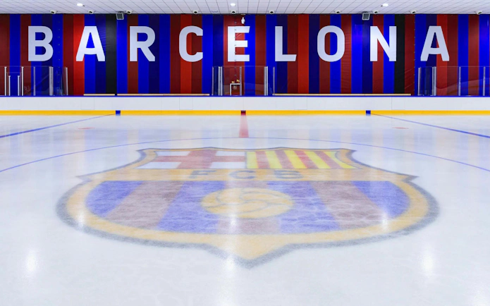 FC Barcelona Ice Rink with club logo on the ice and Barcelona sign in the background.