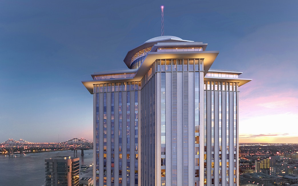 Vue Orleans Observation Deck with city skyline and river view at sunset.