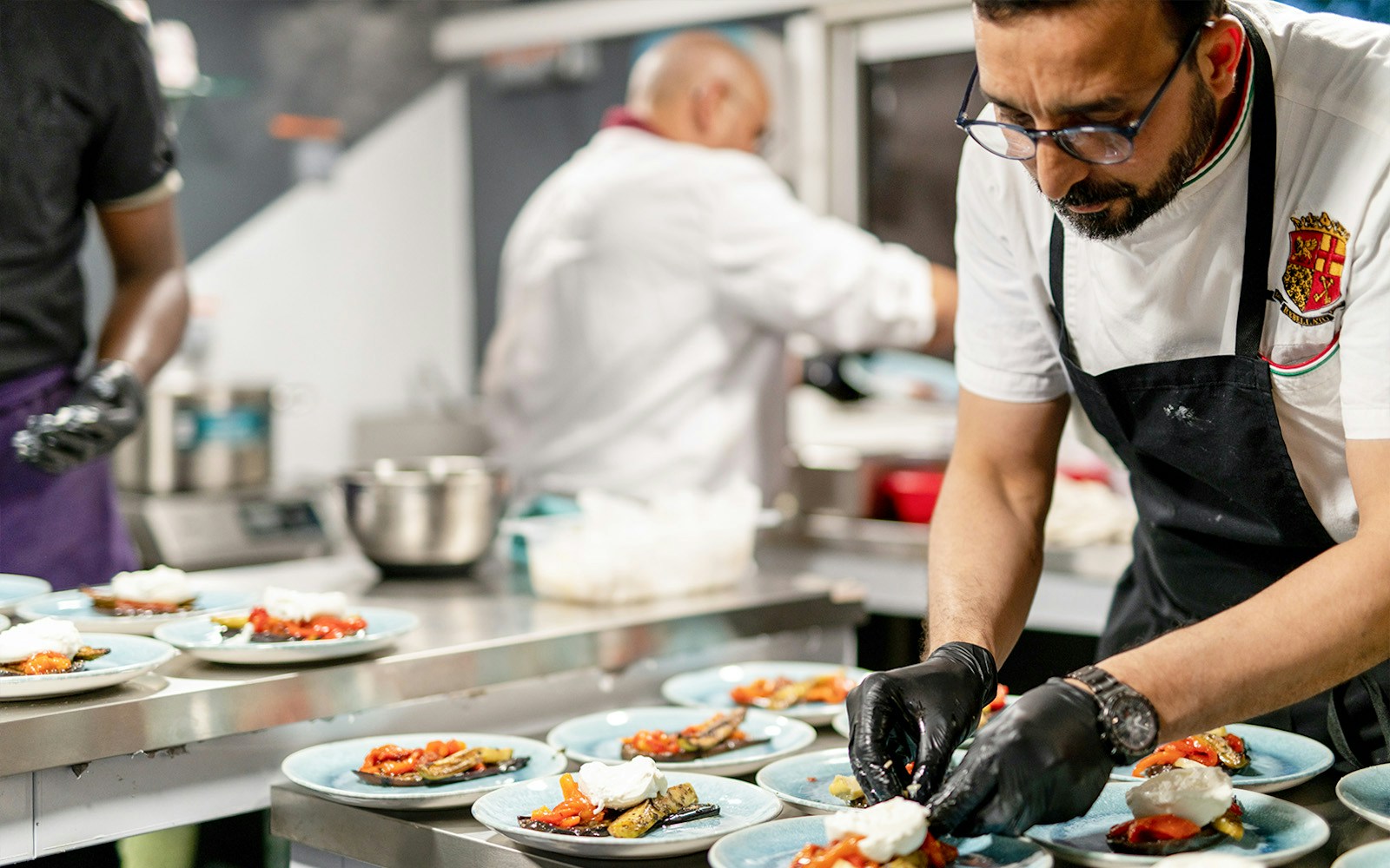 Chefs cooking onboard a brunch cruise in Paris