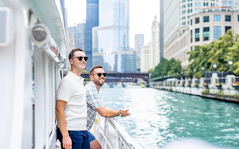 Passengers enjoying views on a Chicago architecture cruise along the river.