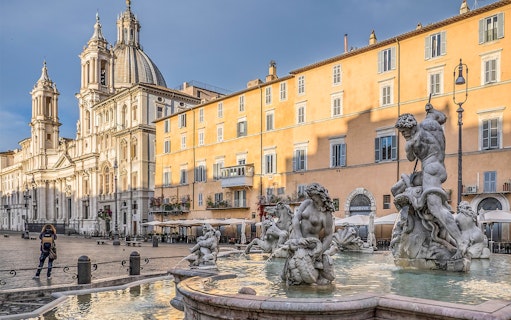 Piazza Navona with Fountain of Neptune in Rome during guided tour.