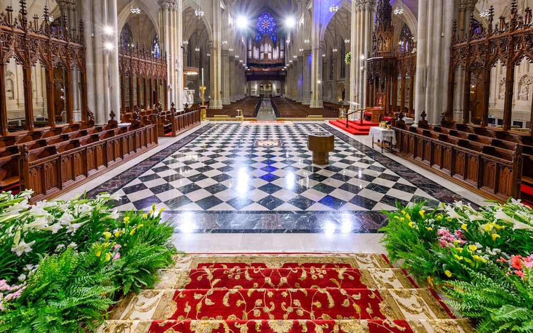 St. Patrick's Cathedral interior with ornate altar and checkered floor, New York City.
