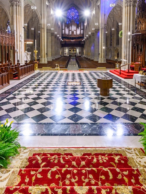 St. Patrick's Cathedral interior with ornate altar and checkered floor, New York City.