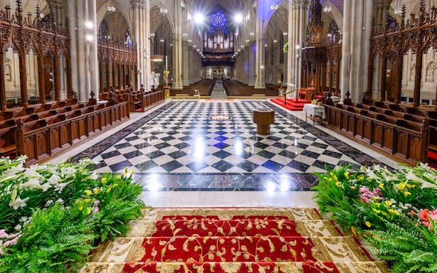 St. Patrick's Cathedral interior with ornate altar and checkered floor, New York City.