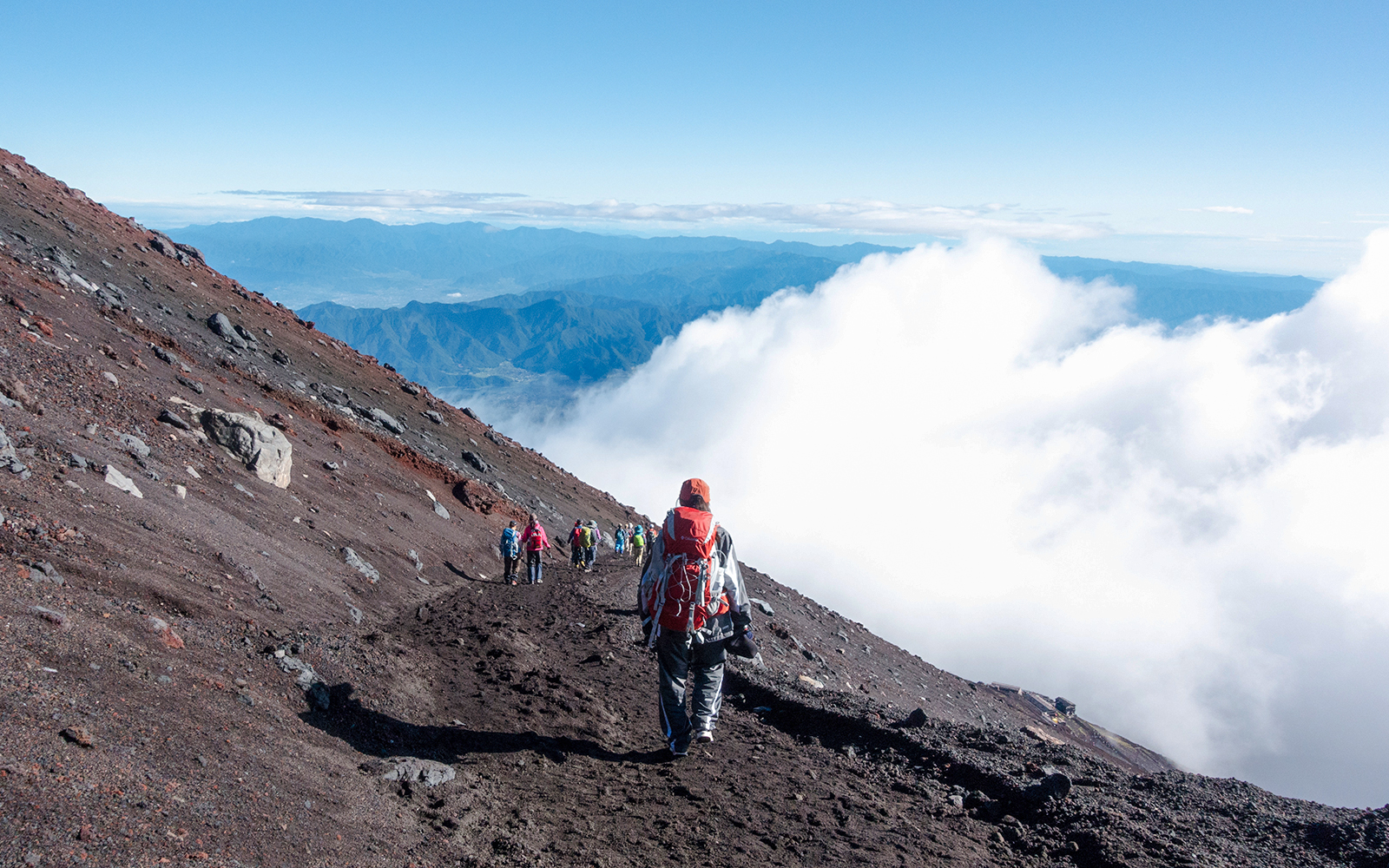 A hiker climbing Mt. Fuji