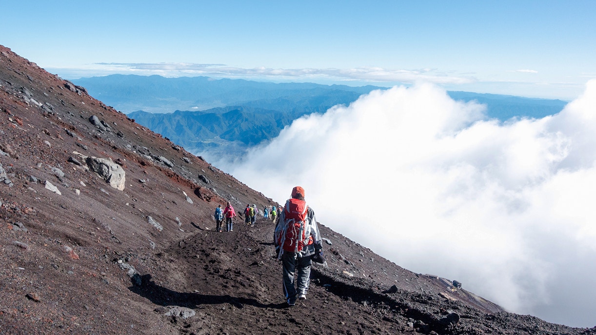 A hiker climbing Mt. Fuji
