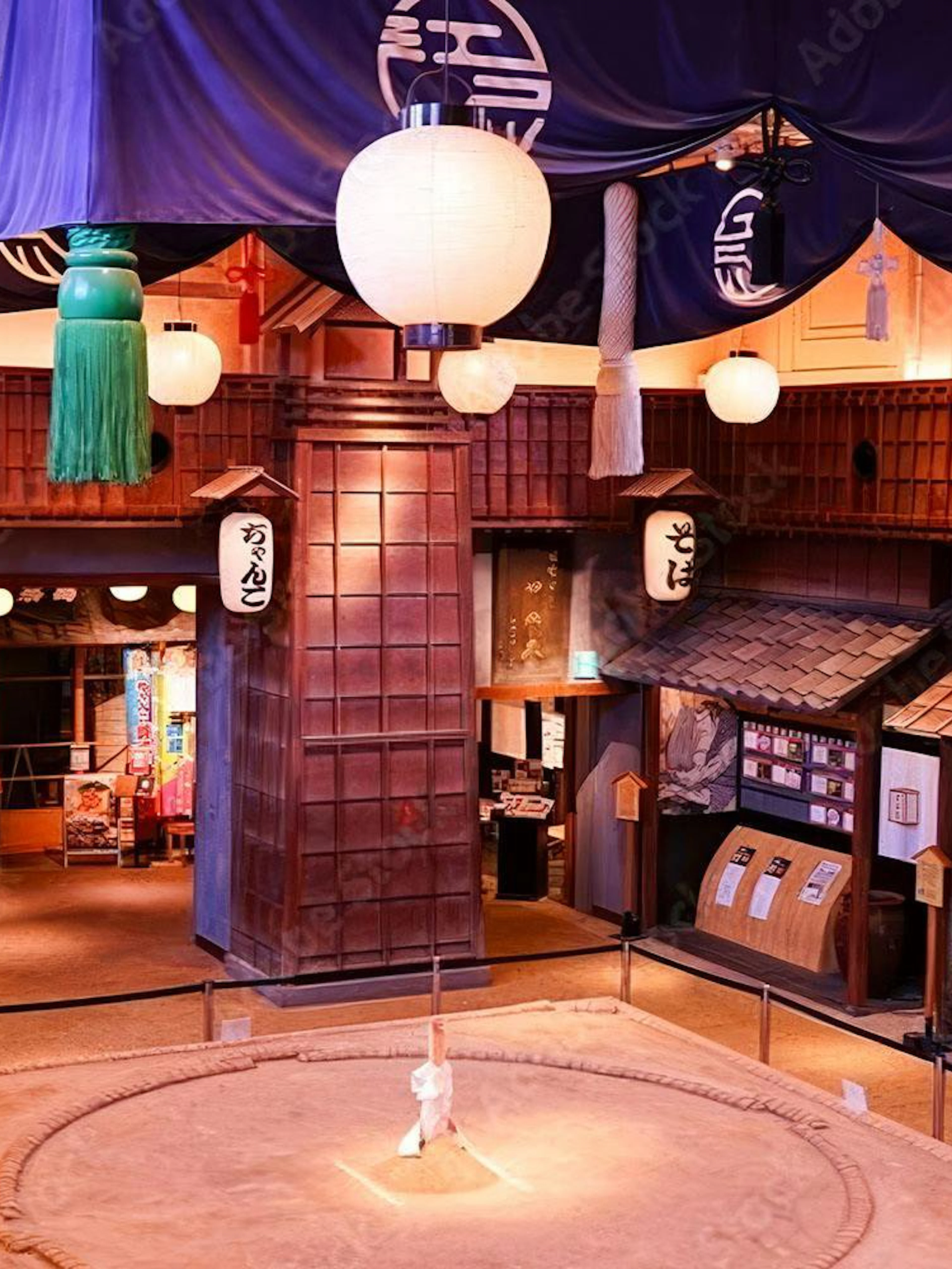 Sumo wrestling ring at Ryōgoku Kokugikan arena, Tokyo, with traditional Japanese decor.