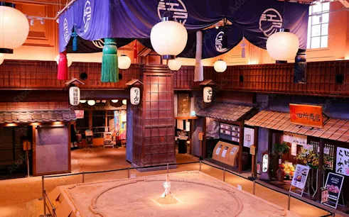 Sumo wrestling ring at Ryōgoku Kokugikan arena, Tokyo, with traditional Japanese decor.