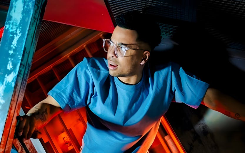 Individual exploring vibrant, tilted room at Prison Island Melbourne.