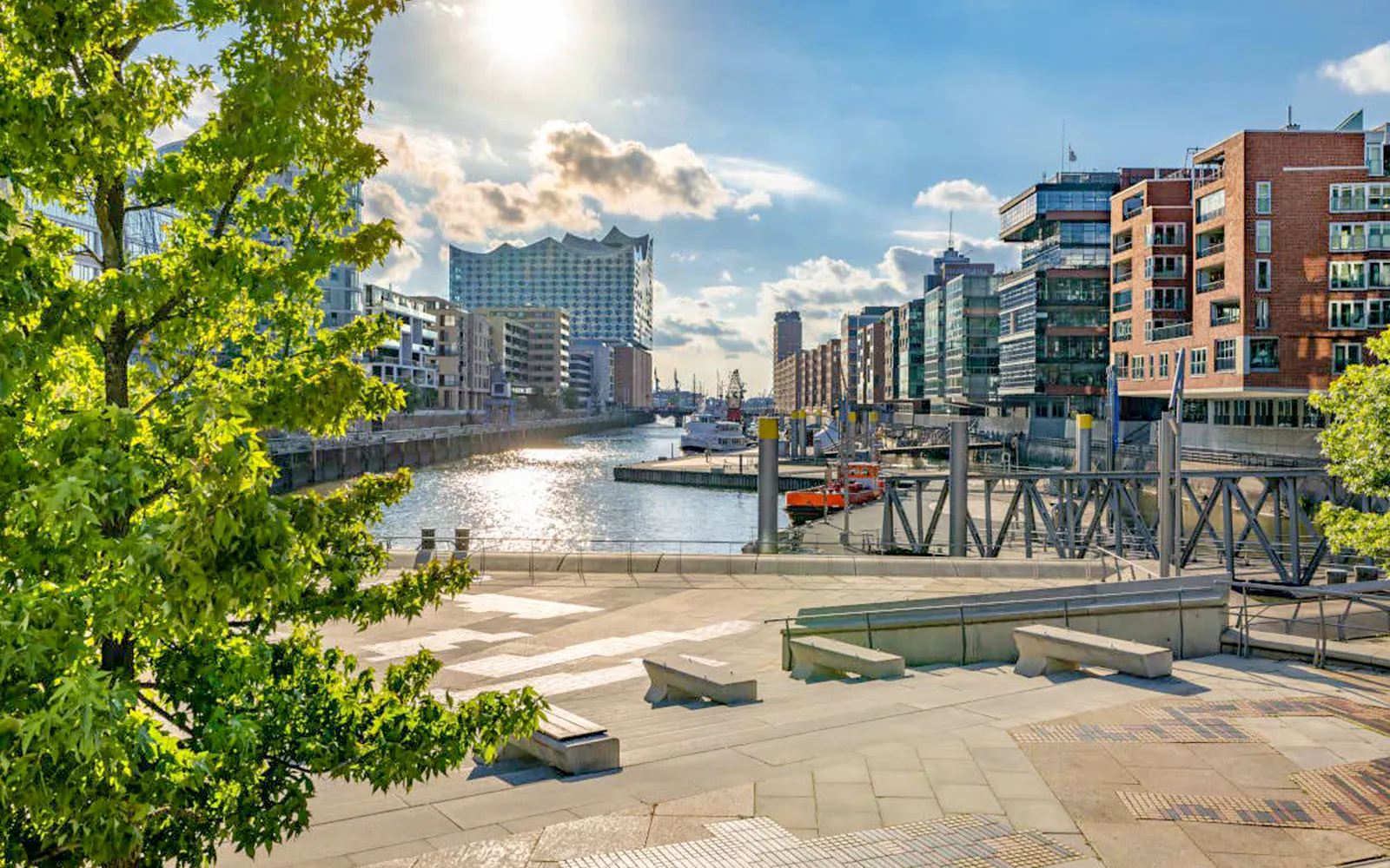 Elbphilharmonie and HafenCity view from Speicherstadt, Hamburg, with canal and modern buildings.