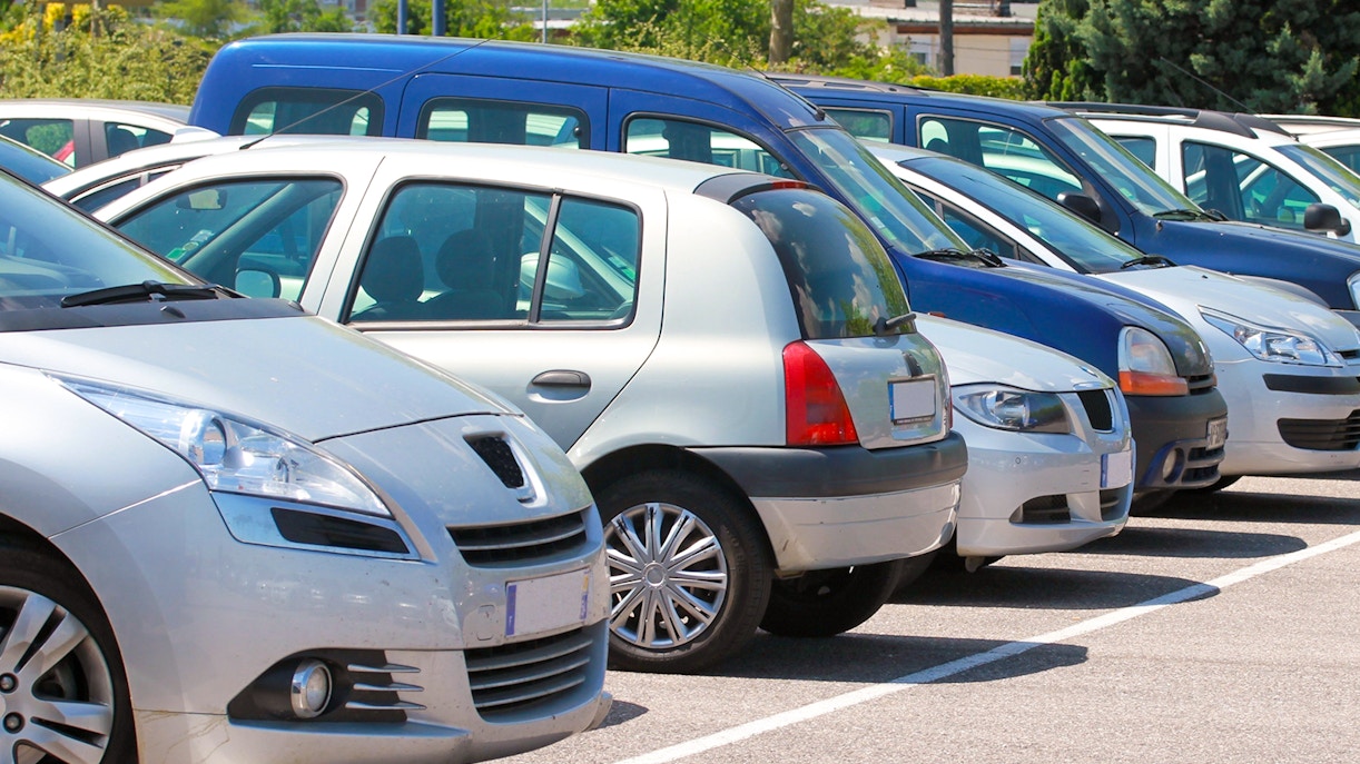 Visitors walking towards the Roman Forum entrance in Rome, Italy, with ancient ruins in view.