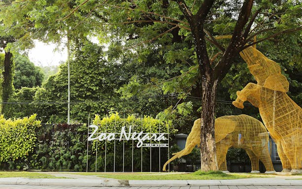 Zoo Negara entrance with elephant sculptures, Malaysia.