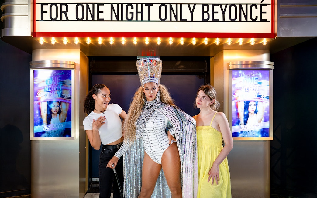 Two friends with Beyoncé's wax figure at Madame Tussauds, New York.