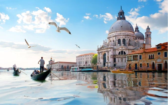 Gondolas on Venice canal near Santa Maria della Salute, part of Casanova's Venice exploration game.