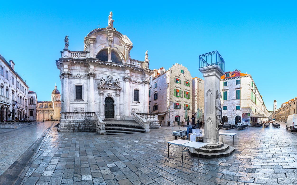 Dubrovnik's historic square with St. Blaise Church and surrounding architecture.