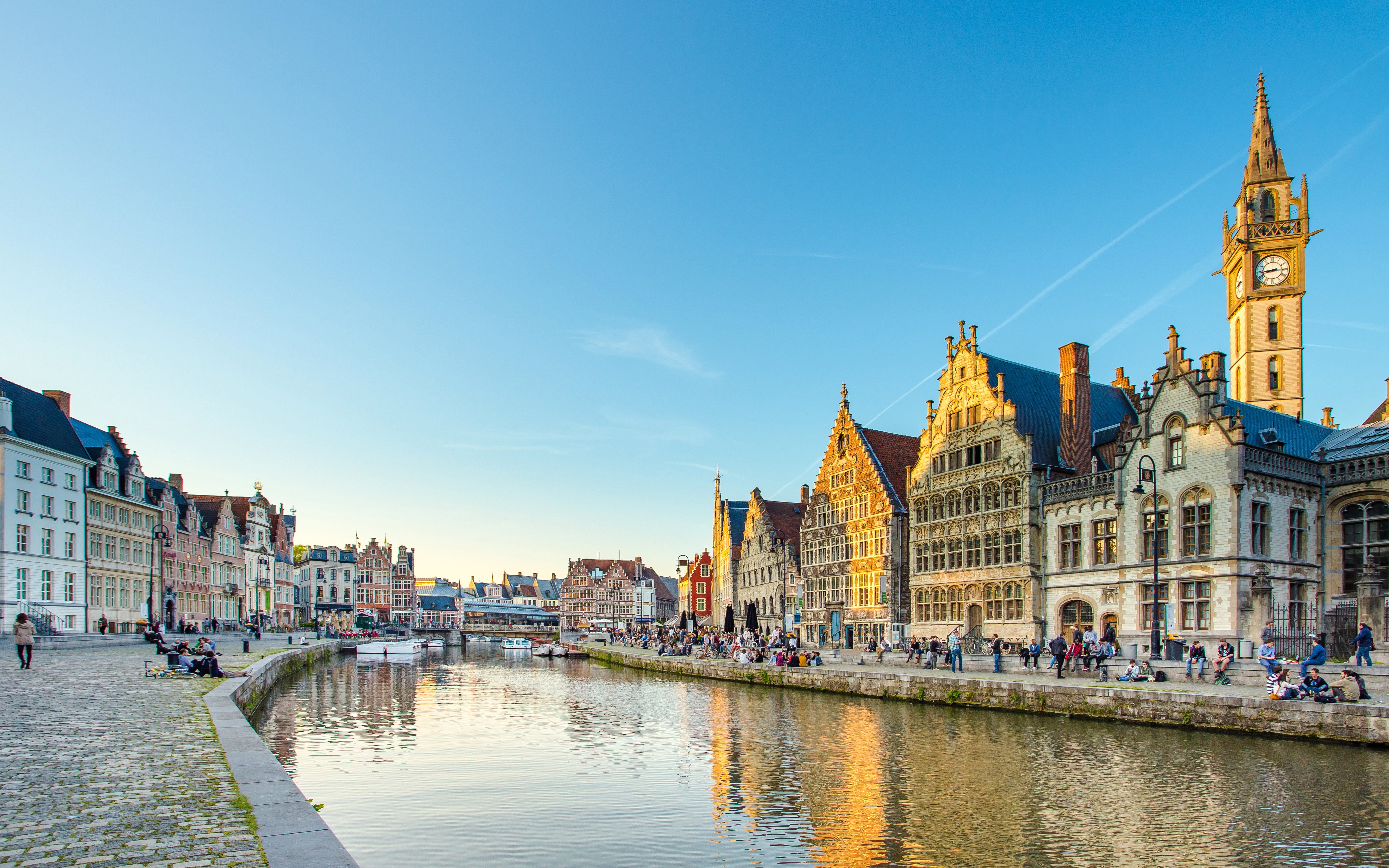 Graslei canal with historic buildings in Ghent city center, Belgium.