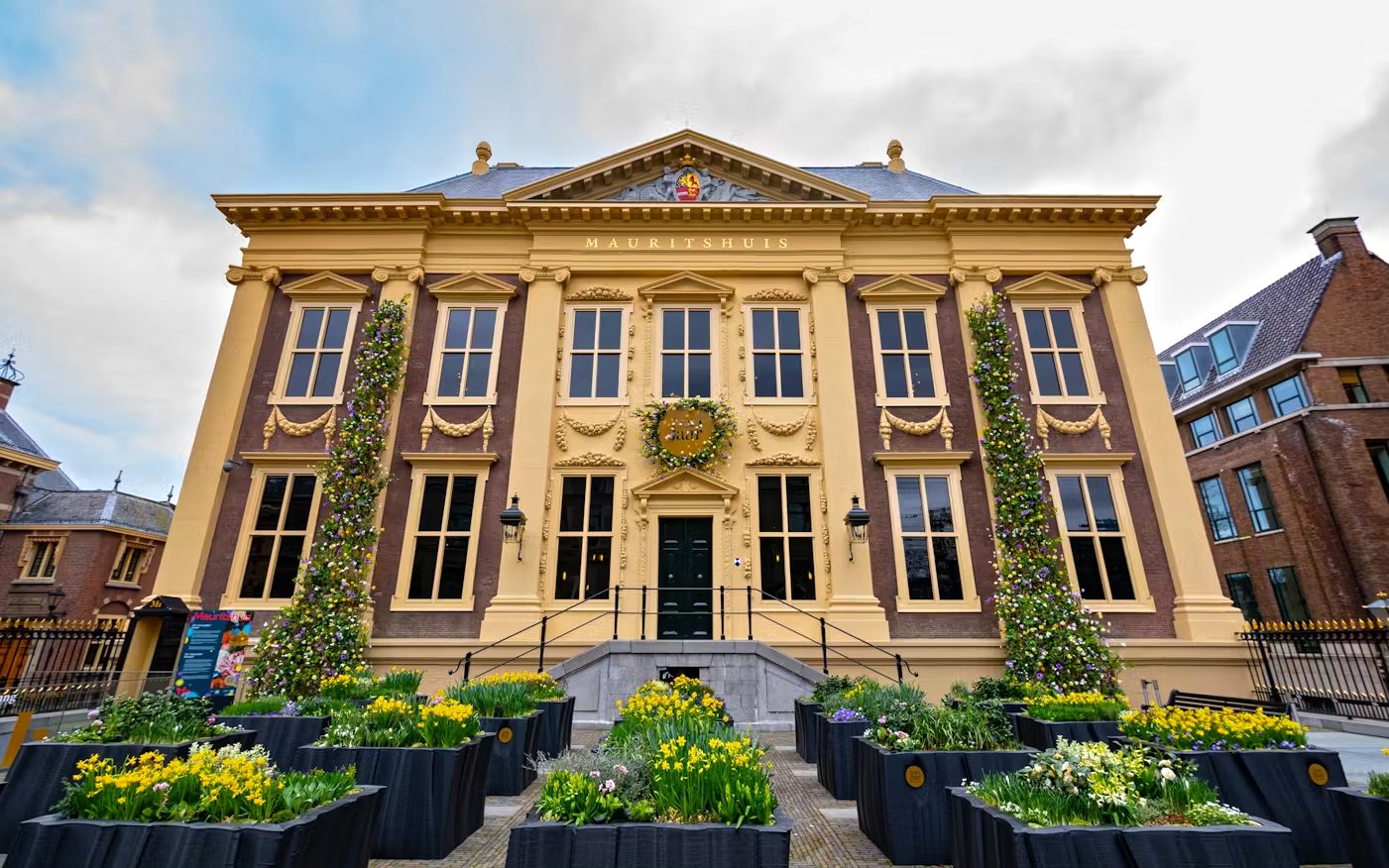 Mauritshuis museum entrance with floral decorations and historic architecture in The Hague.