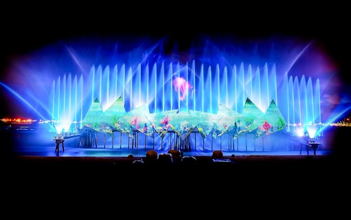 Wings of Time light and water show at Sentosa, Singapore, with vibrant projections.