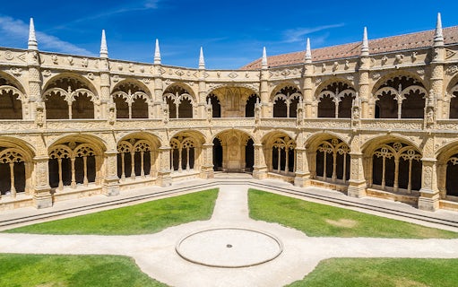 Cloister arches and ornate columns at Jeronimos Monastery, Lisbon, Portugal.