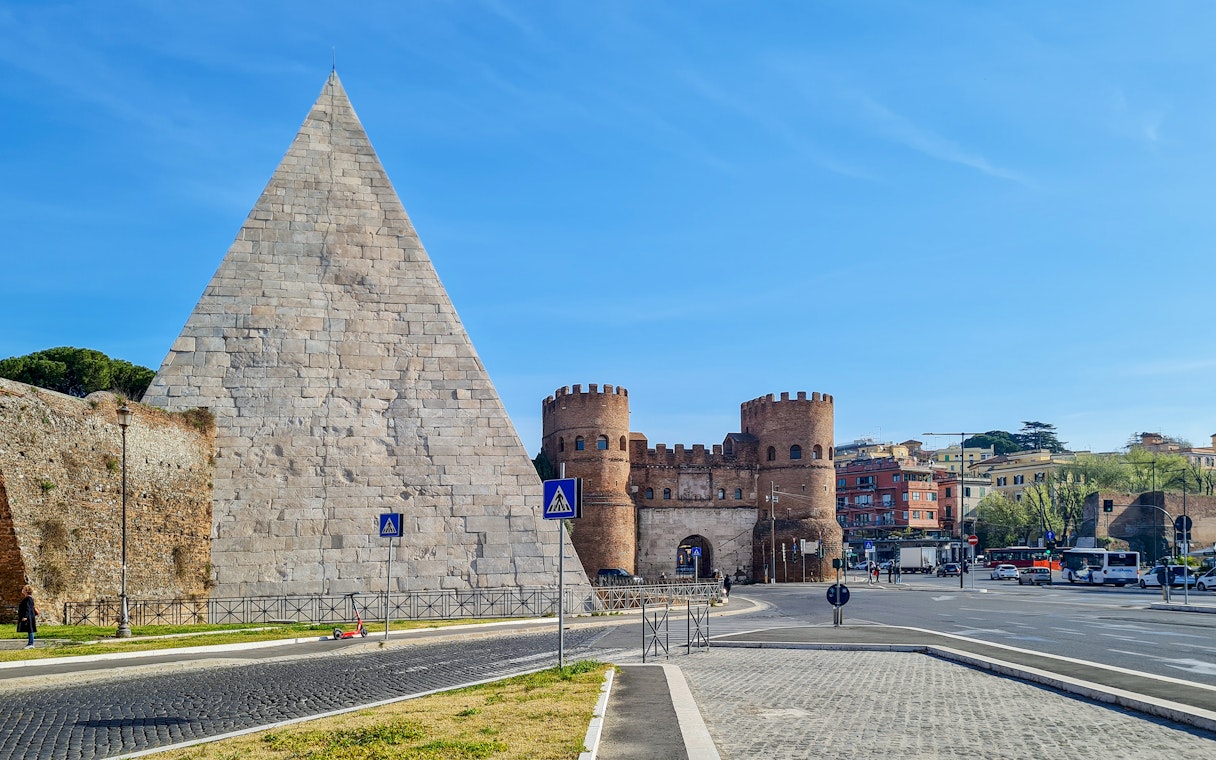 Pyramid of Cestius and Porta San Paolo in Rome, Italy.
