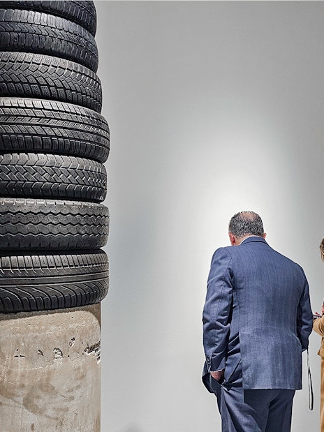 Visitors observing tire sculpture at Picasso's Birthplace Museum.