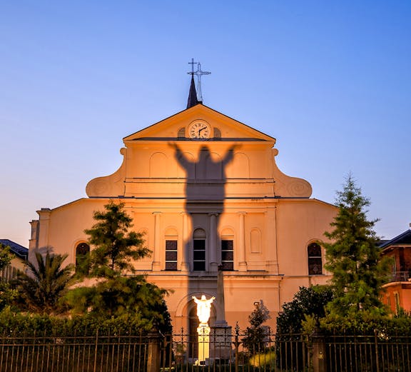 St. Louis Cathedral facade with shadow of Jesus statue, French Quarter, New Orleans.