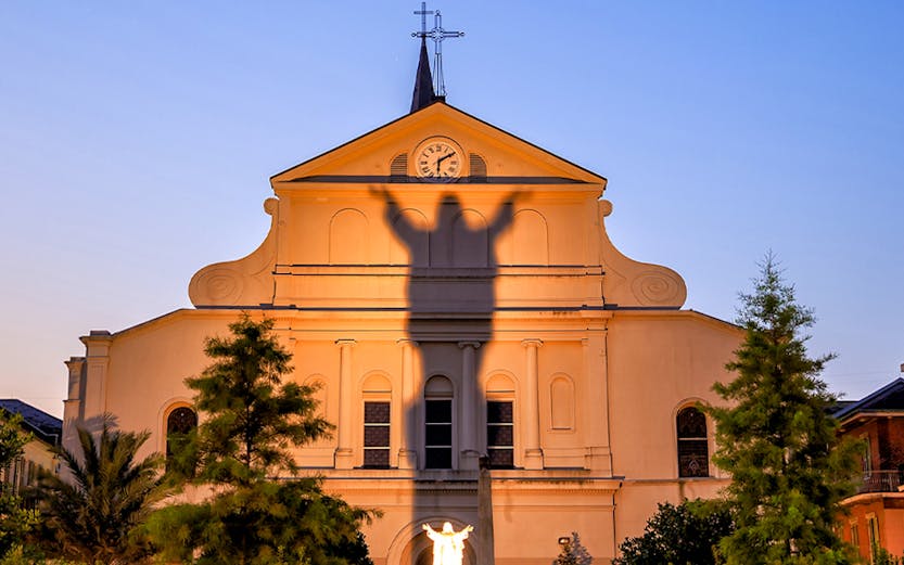 St. Louis Cathedral facade with shadow of Jesus statue, French Quarter, New Orleans.