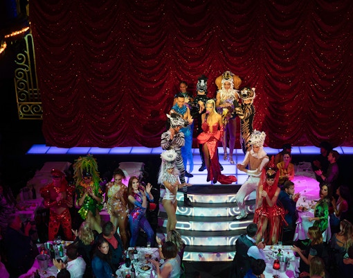 Paradis Latin cabaret show with dinner setup, Paris, Christmas Eve special.