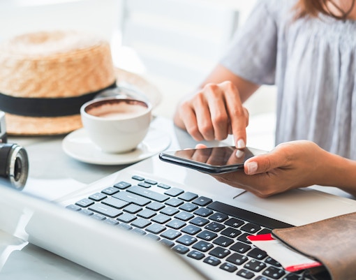 Tourists booking tickets online for a hassle-free experience in Paris, France.