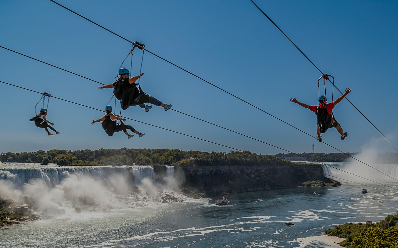 Zipline adventure over Niagara Falls with a view of the cascading waterfalls.