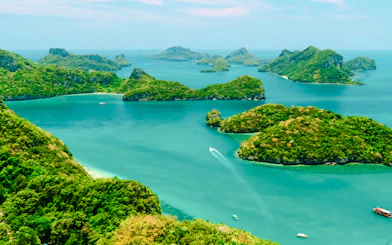 Koh Samui Ang Thong islands with speedboat on turquoise water, Thailand.