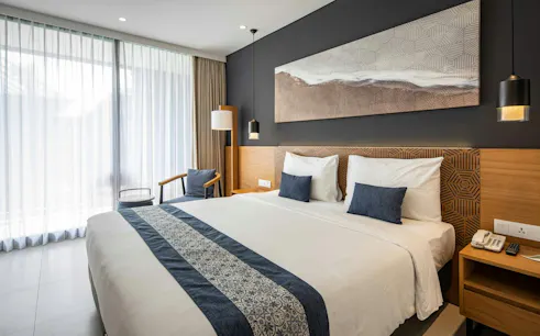 Luxurious bedroom at Ame Spa Bali Wellness Retreat, Citadines Berawa Beach, Bali.