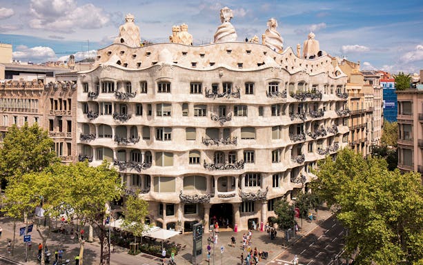 La Pedrera's unique facade in Barcelona, view from street level.