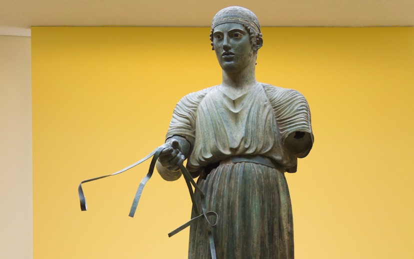 Ancient Greek bronze statue of a charioteer, Delphi Museum, Greece.
