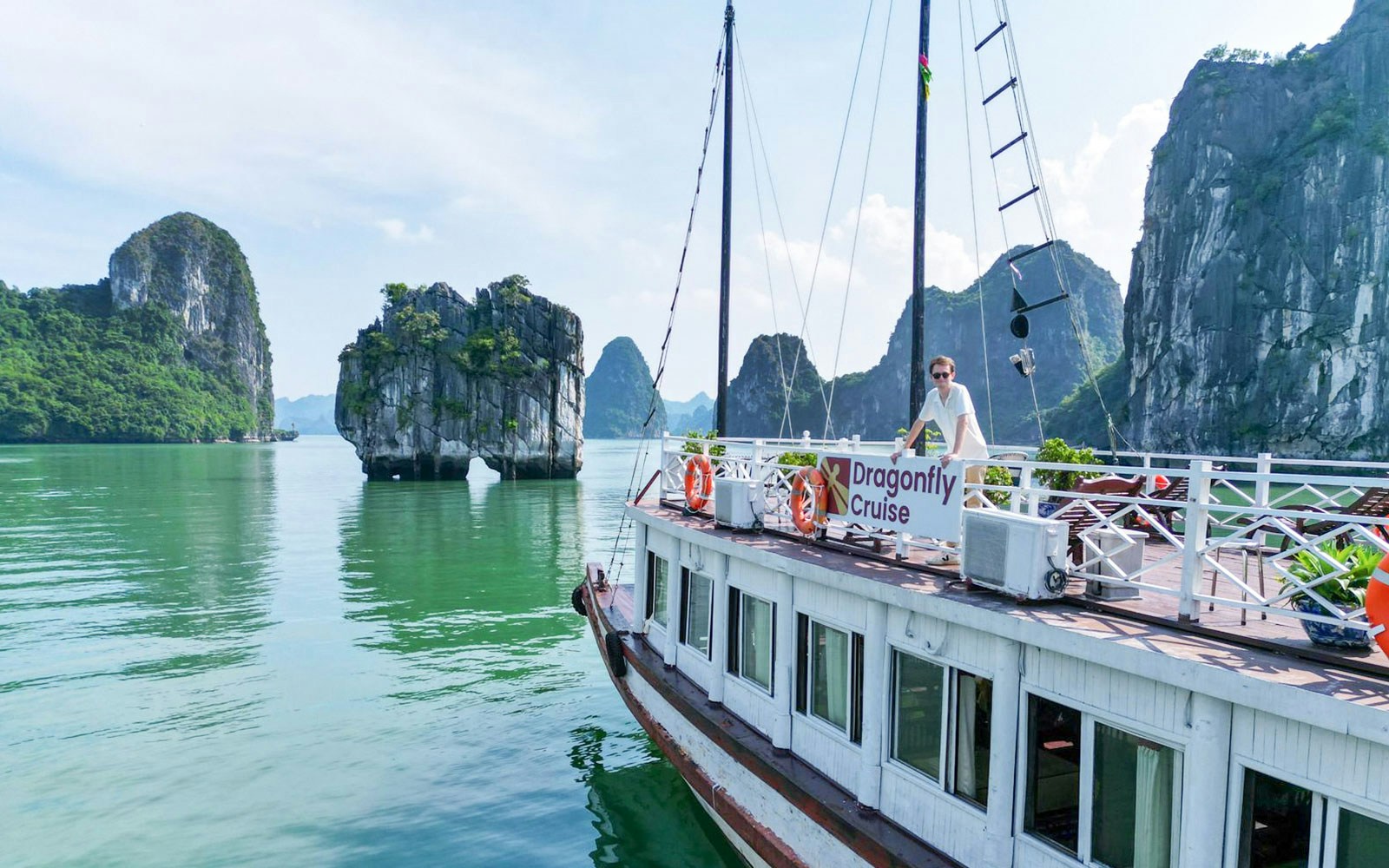 Ha Long Bay limestone karsts and emerald waters on a 3-star cruise, Vietnam.