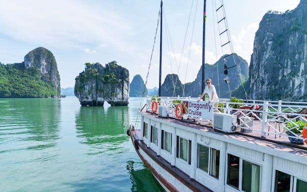 Ha Long Bay limestone karsts and emerald waters on a 3-star cruise, Vietnam.