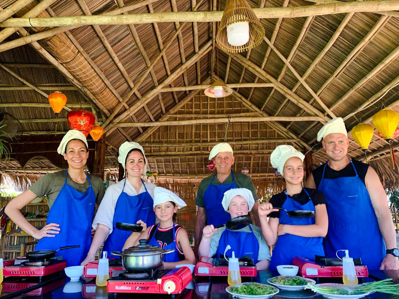 Group cooking class in Hoi An bamboo pavilion during 3 Heritage Craft Villages Bicycle Tour.