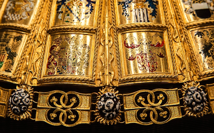 Golden ornate details of a ceremonial robe at the Imperial Treasury, Vienna.