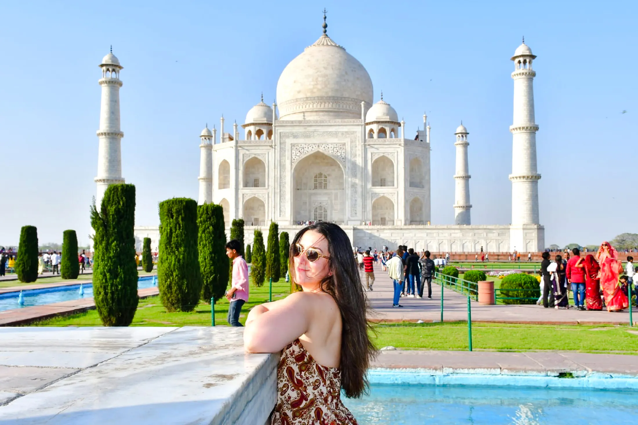 Visitor enjoying the view of the Taj Mahal with fast-track entry in Agra.