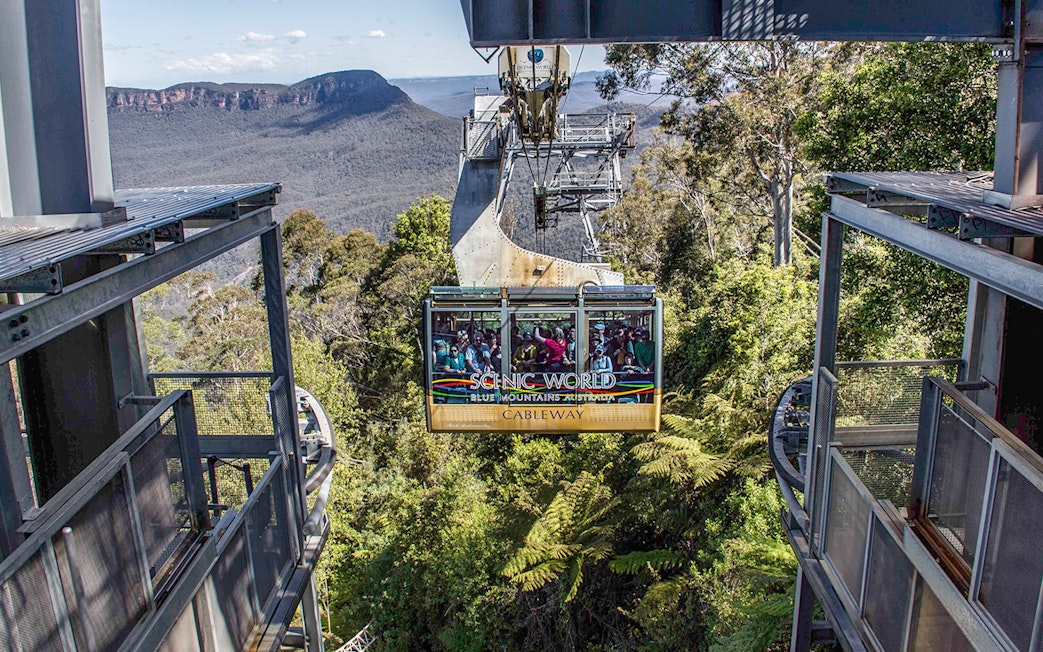 Cableway ride at Scenic World, Blue Mountains with forest and cliffs in view.